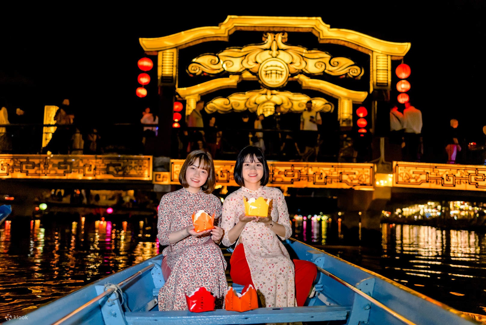 Stroll through a softly lit river where colorful lanterns create a calm and magical atmosphere 